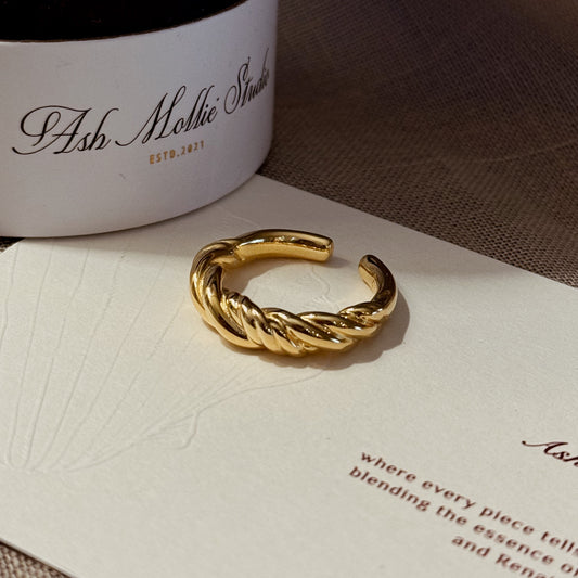 Gold-plated braided ring with a twisted design