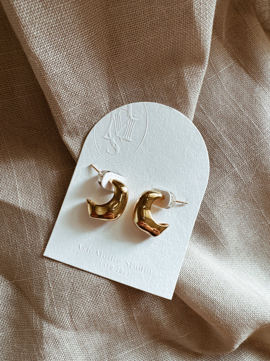 Gold-plated asymmetric sterling silver earrings with modern design.