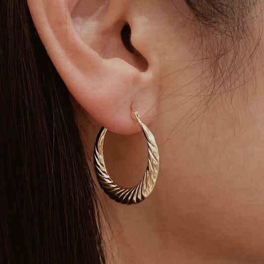 Small gold-plated vintage hoop earrings with spiral texture